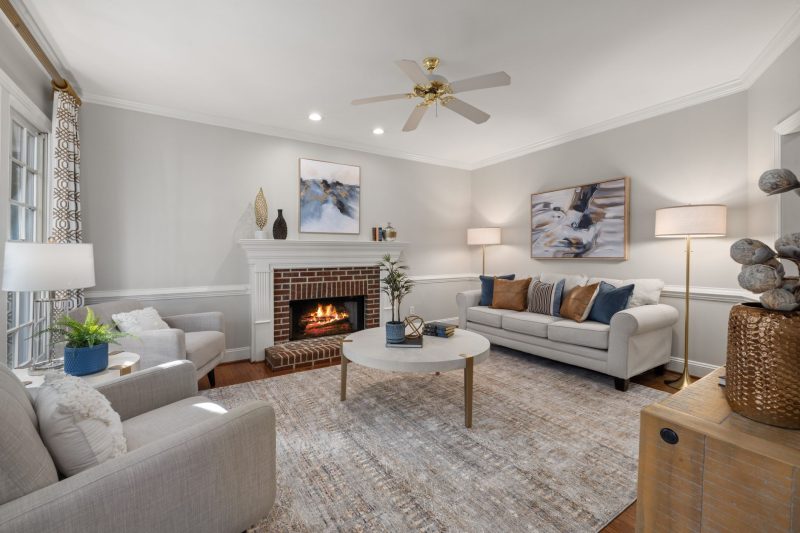 Home 11 A cozy modern living room featuring a fireplace elegant sofa 1788282050